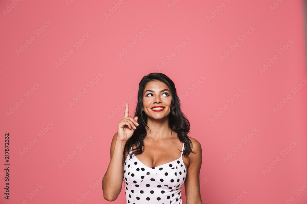 Amazing beautiful woman in swimwear pointing. Amazing beautiful woman in swimwear pointing.