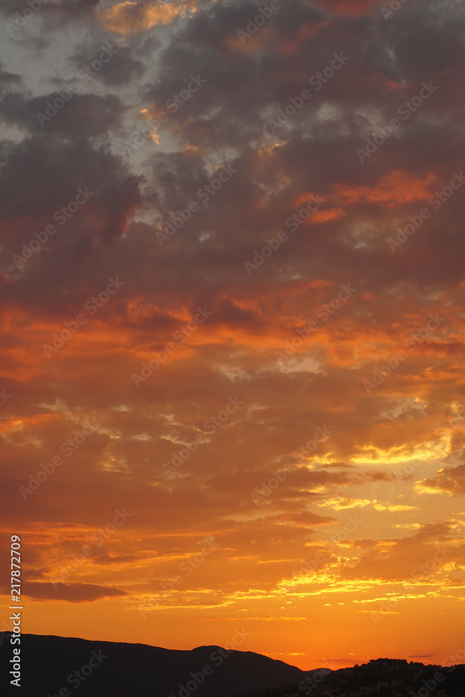 Orange cloudy sky during a sunset