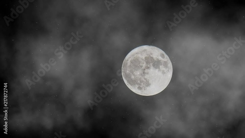 Animation of mystical full moon in the fog on the dark night sky with shining stars.