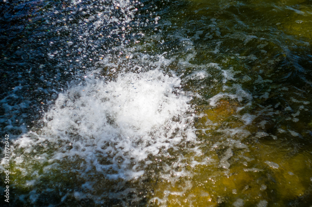 transparent falling vertical water flows, close up transparent falling vertical water flows, close up