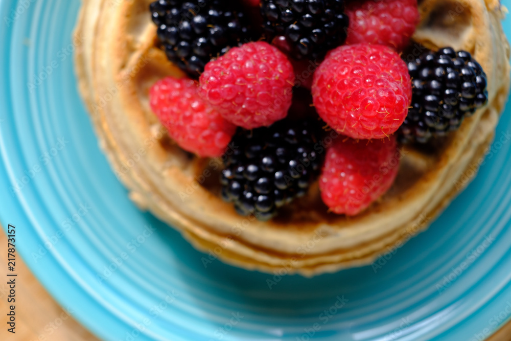 Waffles with raspberries and blackberries for breakfast Waffles with raspberries and blackberries for breakfast