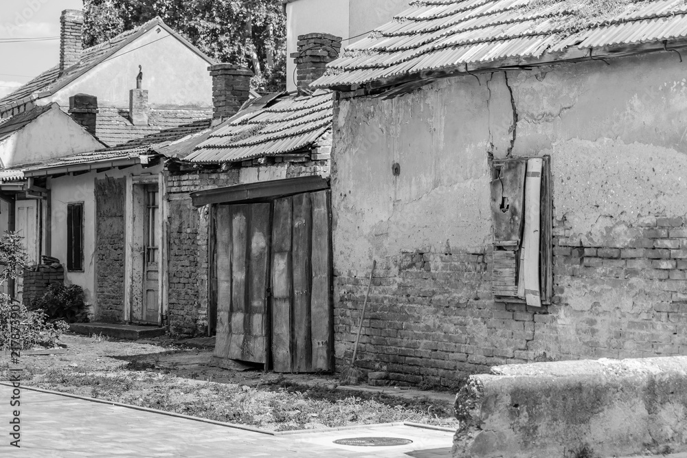 Old abandoned weathered houses, black & white