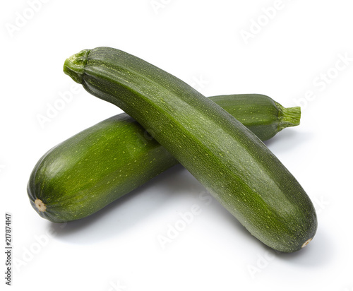Two fresh zucchini isolated on white background.