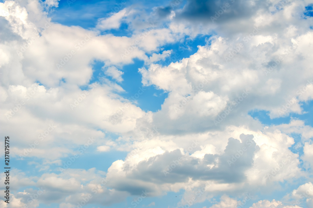 Naklejka premium Snow-white fluffy Clouds on a blue sky