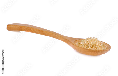 Brown sugar on wooden spoon isolate on white background