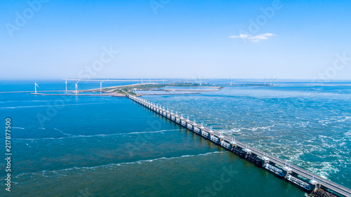 Küstenaufnahme aus der Luft mit der Drohne der Deltawerke als Damm in Zeeland Oosterschelde als Hintergrund photo