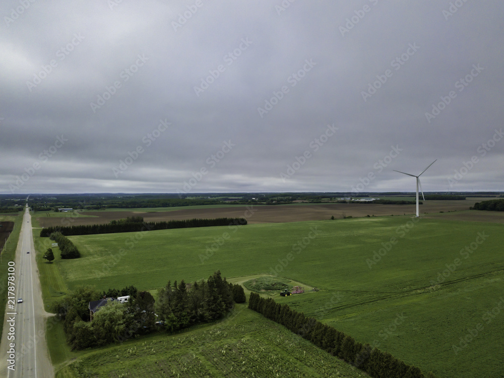 Aerial View Of Wind Turbine Park In canada Agriculture fields in the background