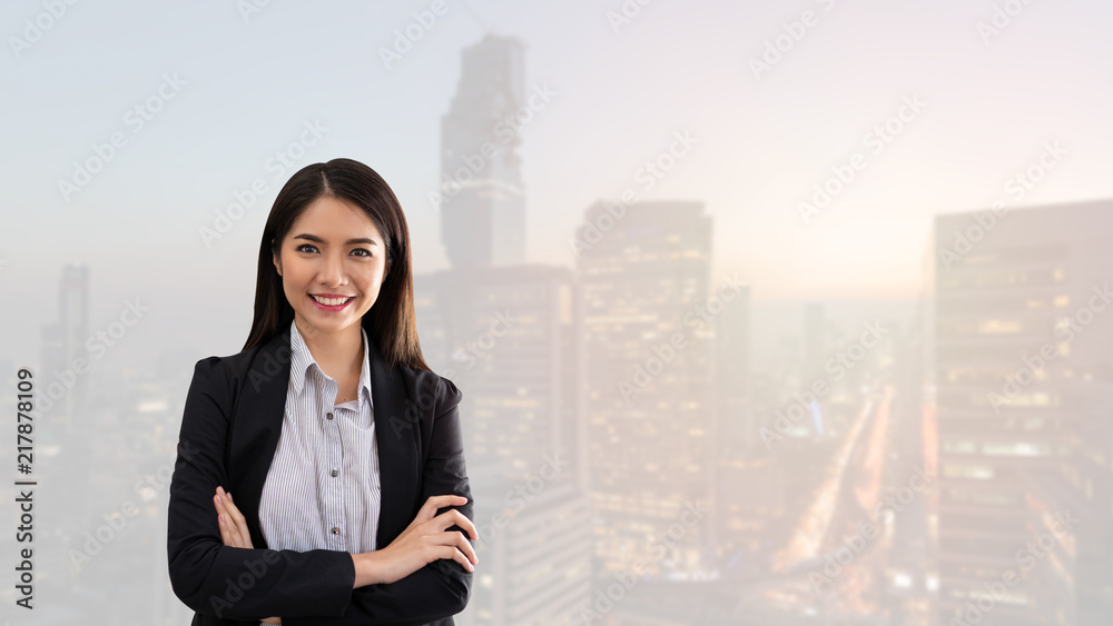 Beautiful Asian business woman standing smiling happy with crossed arms in Bangkok City. . Beautiful Asian business woman standing smiling happy with crossed arms in Bangkok City. .