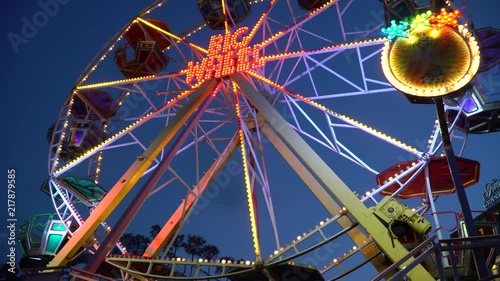 Big wheel illuminated colorful lights spinned motion