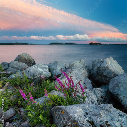 Heater by lake in sunset