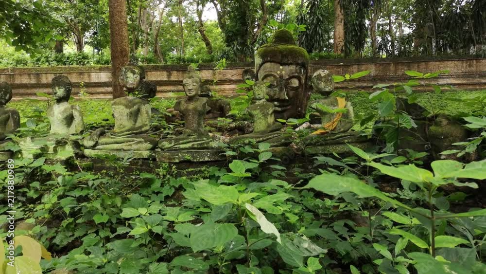 Buddha field of broken sculpture with beautiful ancient Buddha statue