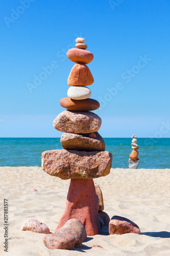 Photography Rock zen pyramid of colorful pebbles on the background of the sea