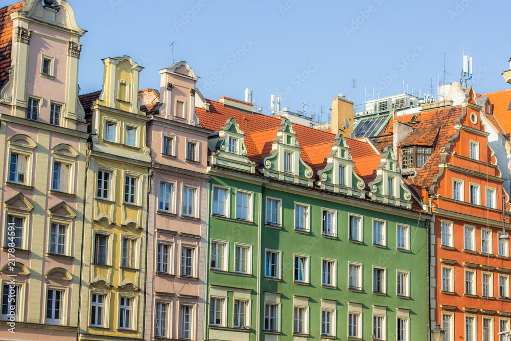 symmetry old colorful building facade concept on blue sky background