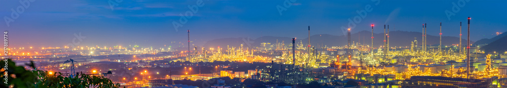 Fototapeta premium panorama of oil refinery and mountain background