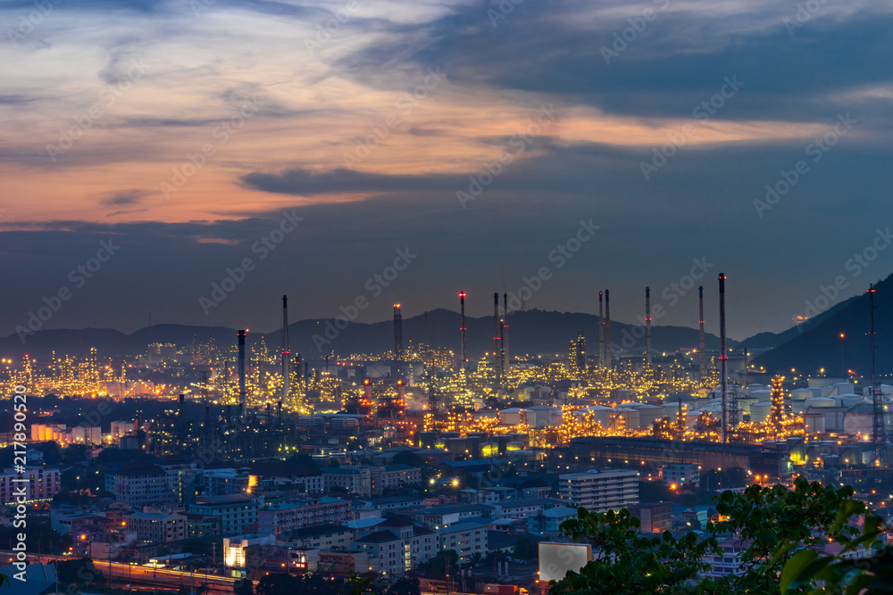 scenic of oil refinery on sunset twilight skyline