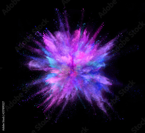 Coloured powder explosion isolated on black background