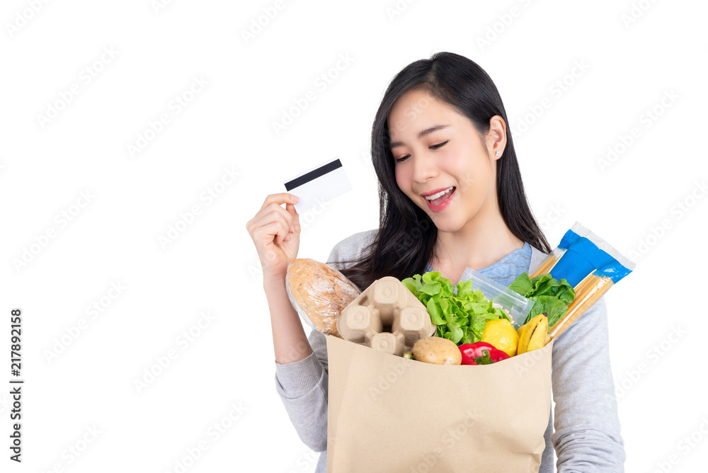 Asian woman using credit card for vegetable and grocery shopping Asian woman using credit card for vegetable and grocery shopping