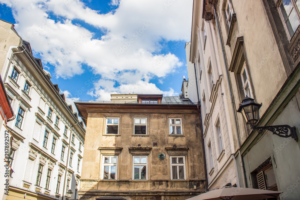 Fototapeta premium old poor european buildings facade in backstreet slum city district with corner narrow shape street 