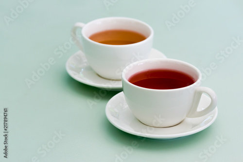 Wallpaper Mural Two white cup of herbal tea on the mint table. Feels cozy. Torontodigital.ca