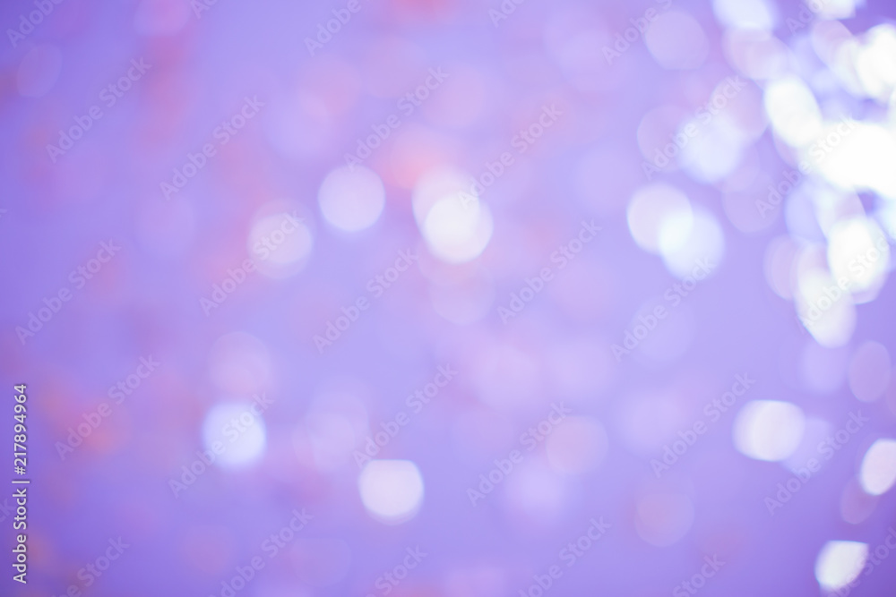 Purple lights with blur. It looks like a holiday with serpentine, glow and brilliance.