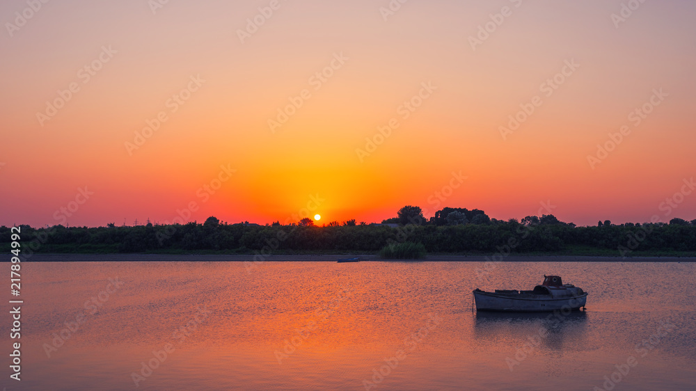 Amazing beautiful sunset on the river, evening time