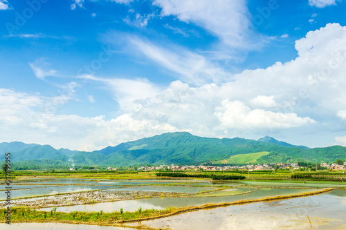 Pastoral villages under blue sky and white clouds