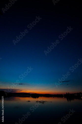 Lake at sunset. Evening landscape