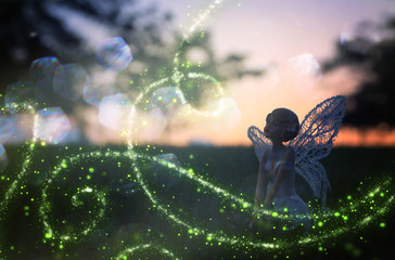 image of magical little fairy in the night forest.