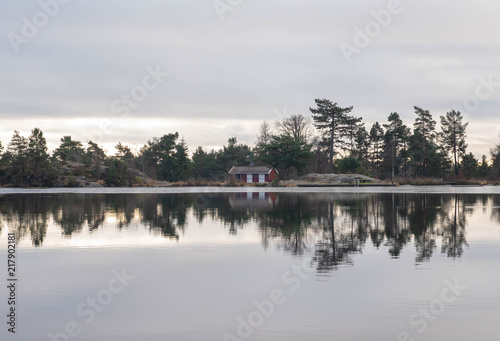 cabin and lake reflection