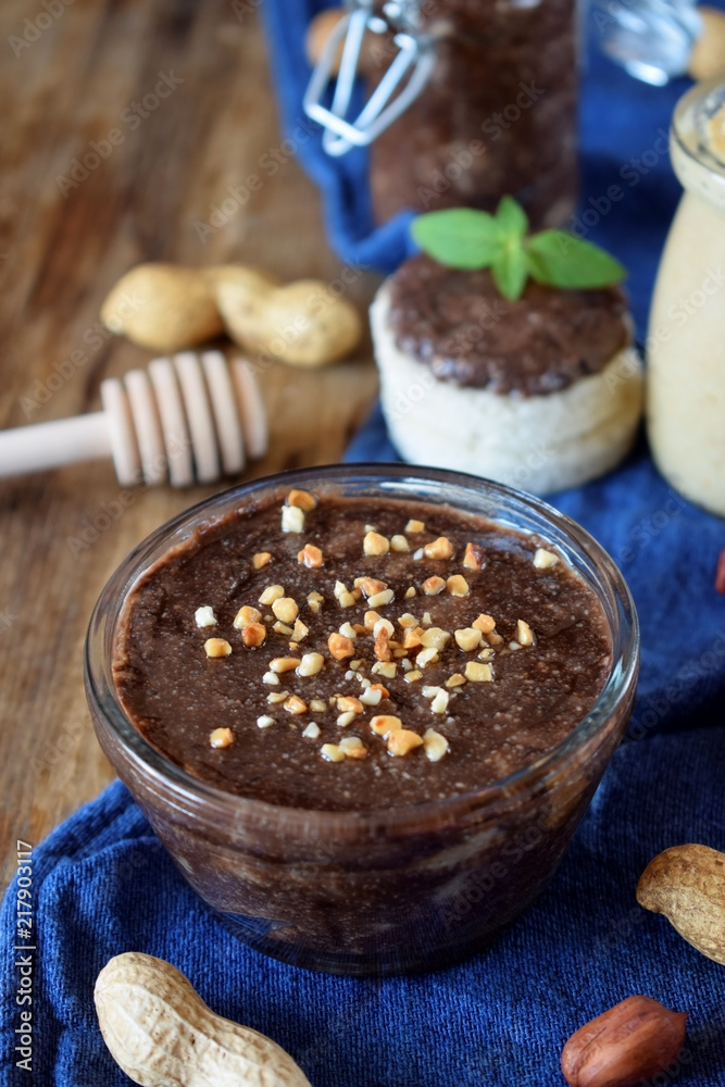 Peanut urbech with chocolate surrounded by the ingredients Peanut urbech with chocolate surrounded by the ingredients