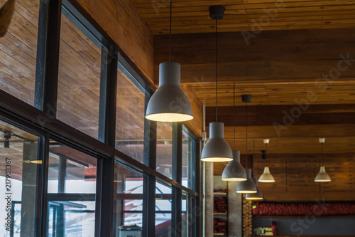 Suspended ceiling lamp sorted in a row, vintage style. photo