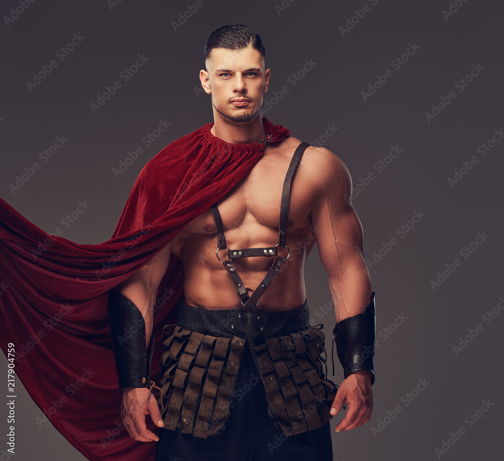 Brutal ancient Greece warrior with a muscular body in battle uniforms Brutal ancient Greece warrior with a muscular body in battle uniforms
