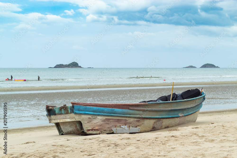 Wooden boat on the sand The seaside at Suan Pradipat in Prachuap Khiri Khan , Thailand.