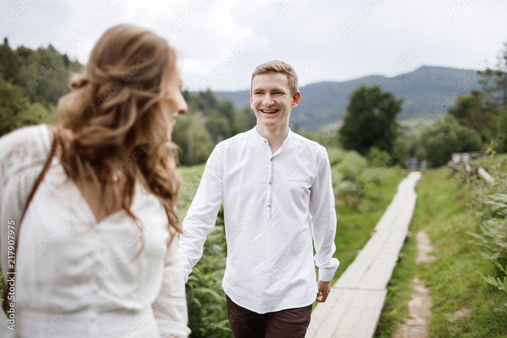 Happy pregnant family having fun time in summer nature. Happy pregnant family having fun time in summer nature.