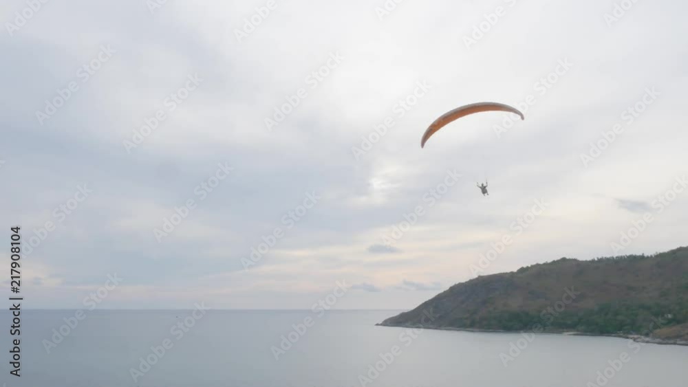 Paragliding over beautiful cape at sunset. Paragliding over beautiful cape at sunset.