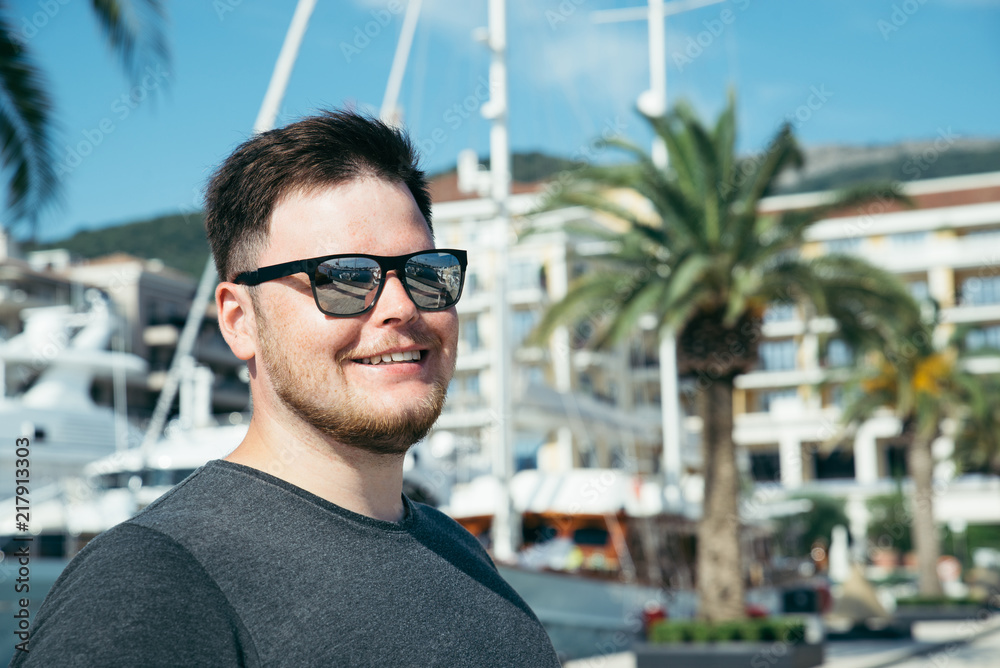 portrait of man yachts and dock on background portrait of man yachts and dock on background