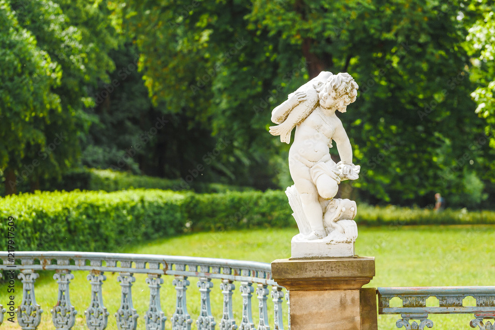cupid statue in garden or park