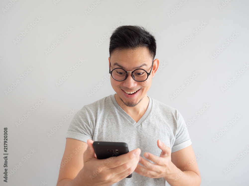 Man happy to see what in the smartphone. Man happy to see what in the smartphone.