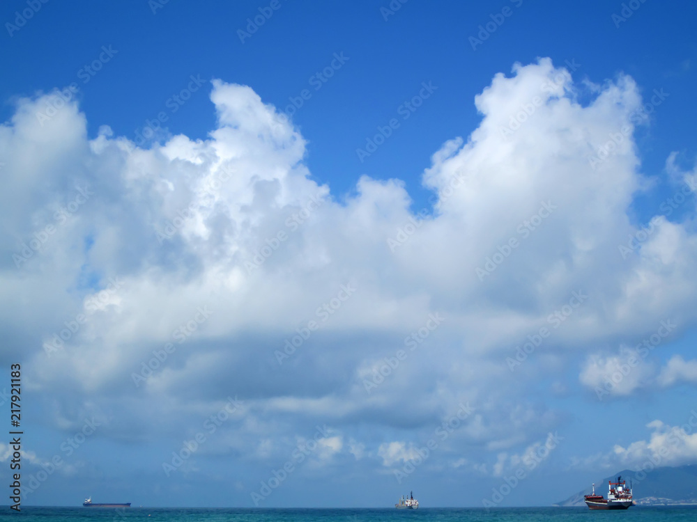 blue sky in white clouds over the sea