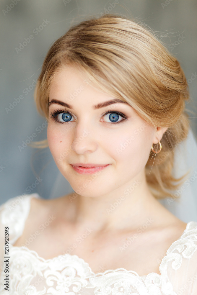 Young stylishly dressed bride on wedding day in stylish studio. Wedding day. Beautiful young bride, just married. Shallow focus. Bokeh. Young stylishly dressed bride on wedding day in stylish studio. Wedding day. Beautiful young bride, just married. Shallow focus. Bokeh.