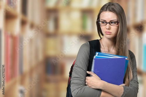 Young Student Girl with backpack and books