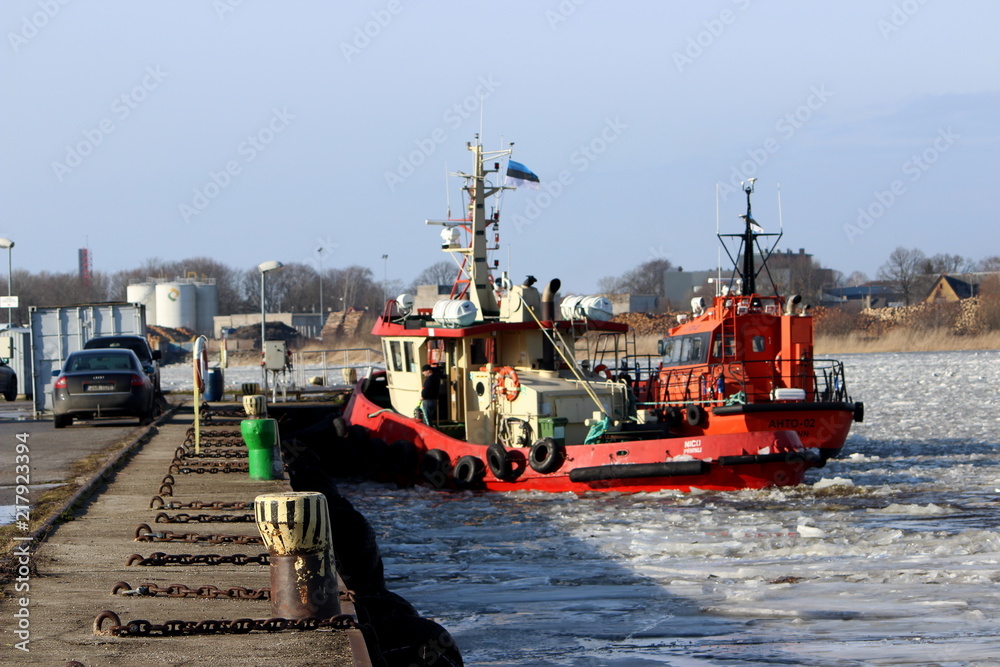 Fototapeta premium ice breacker ship in frozen river in pärnu, estonia
