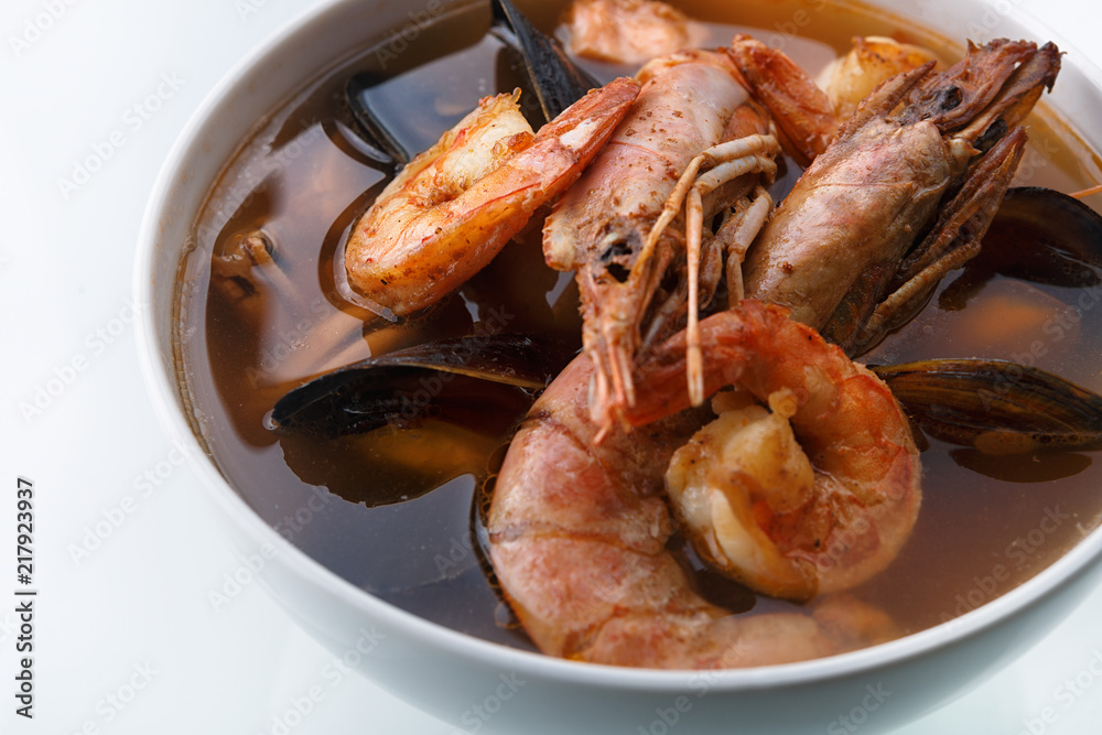 Seafood soup. Shrimp. Mussels. The scallop. On a white background Seafood soup. Shrimp. Mussels. The scallop. On a white background
