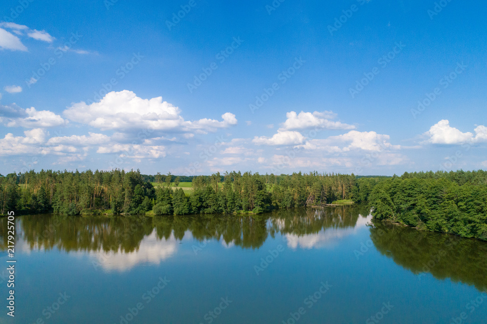 A beautiful calm lake surrounded by forest