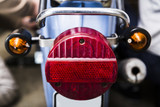 Close up taillight on old dirty vintage motorcycle
