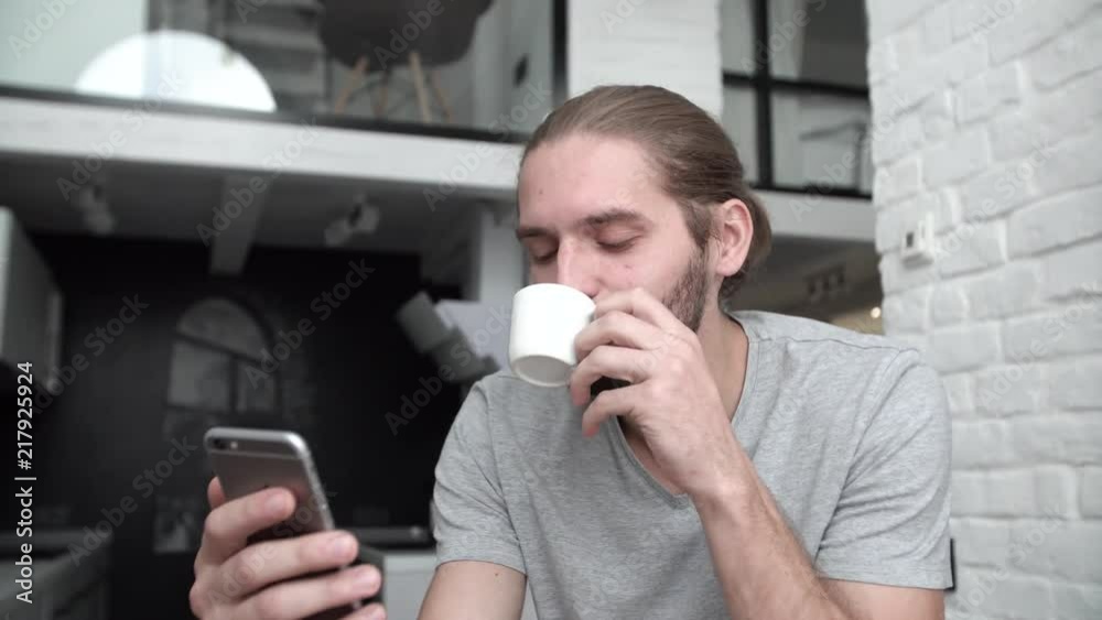 Man With Mobile Phone Drinking Coffee At Home Kitchen Man With Mobile Phone Drinking Coffee At Home Kitchen