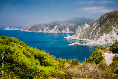Coastline near Agia Eleni and Pitani beach in Kefalonia Island, Greece. Most beautiful rocky wild beaches with clear emerald water and high white limestone cliffs landscape