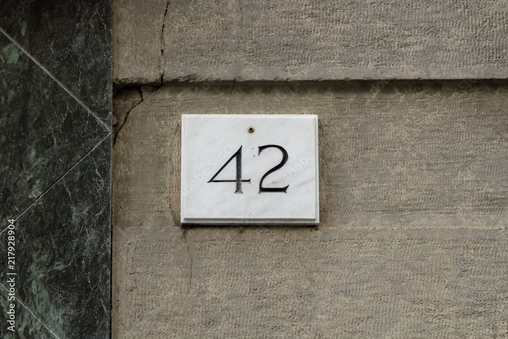 42 numero marmo casa , numero civico antico,primo piano Stock Photo | Adobe  Stock
