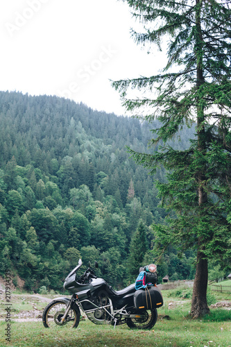 Adventure Motorbike with beautiful mountains green forest. Motorcycle trip. off road Traveling, Lifestyle Travel vacations sport outdoor concept. vertical photo