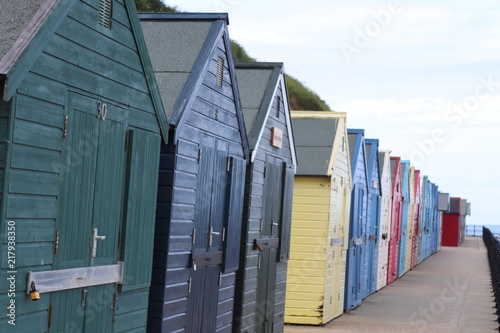 colourful beach huts on mundesley beach front